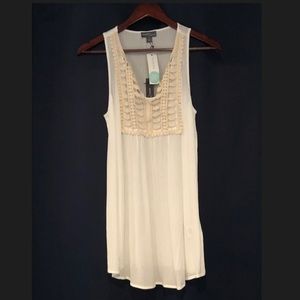 white sleeveless shirt with crochet neckline